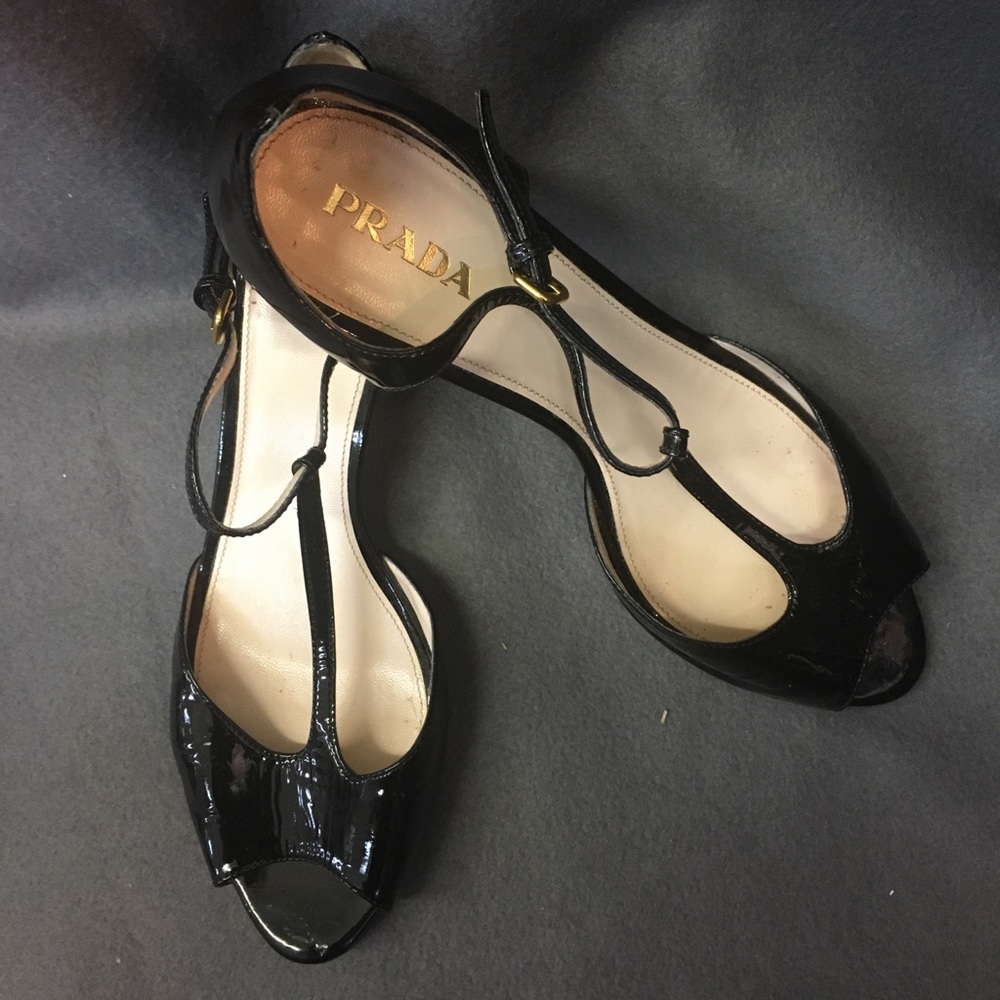 Prada black patent sandals.